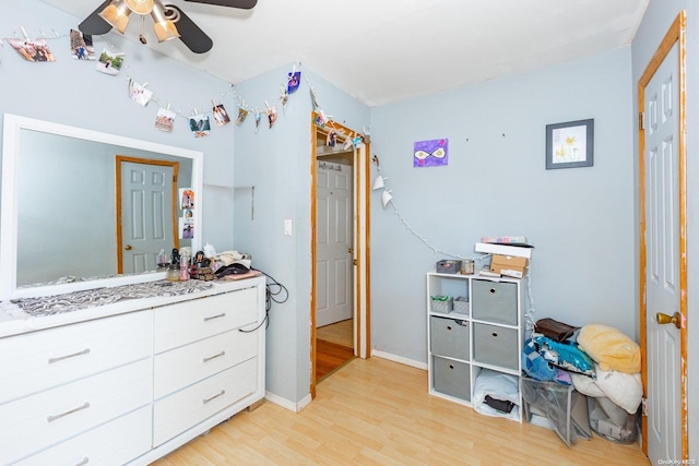 bedroom featuring light hardwood / wood-style floors and ceiling fan