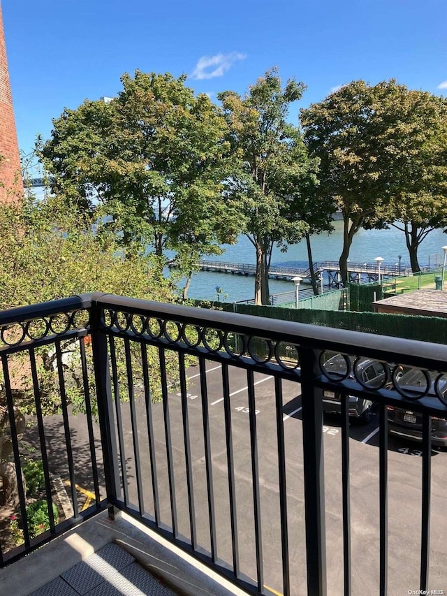 balcony featuring a water view