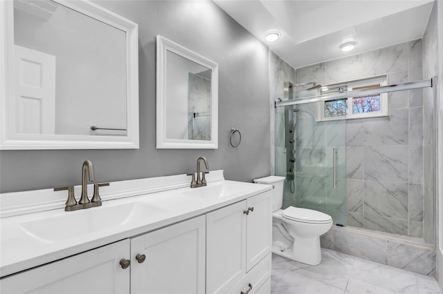 full bathroom with a sink, a marble finish shower, marble finish floor, and double vanity