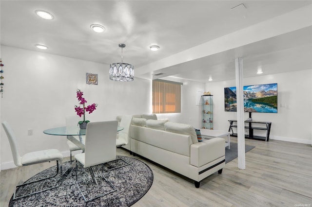 living area with recessed lighting, light wood-type flooring, and baseboards