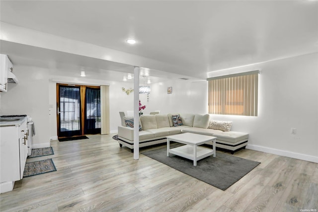 living room featuring light wood-style flooring and baseboards