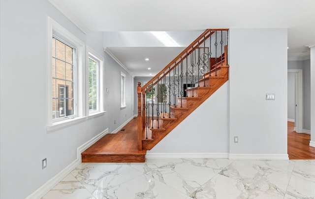 stairway featuring crown molding