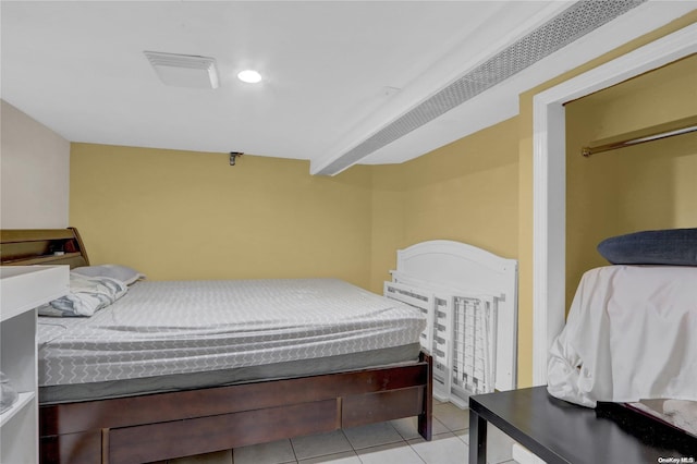 bedroom with light tile patterned floors