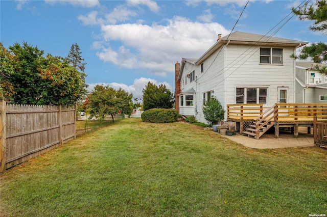 view of yard with a wooden deck