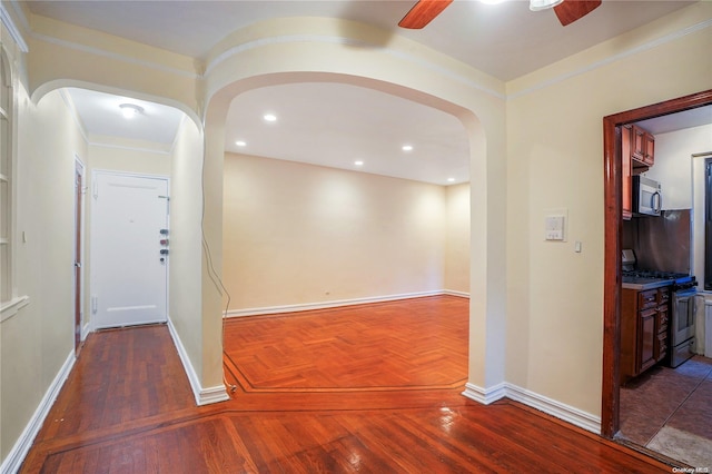 hallway featuring crown molding and dark wood-type flooring