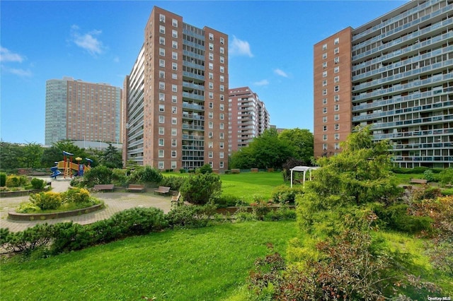 view of property's community with a yard