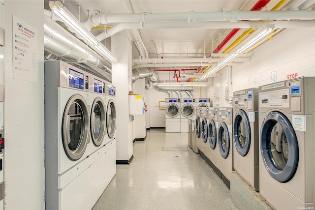 clothes washing area featuring washing machine and dryer