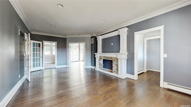 unfurnished living room with dark hardwood / wood-style floors, a stone fireplace, baseboard heating, and ornamental molding