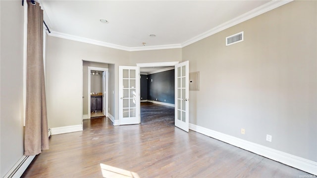 unfurnished room with hardwood / wood-style flooring, a baseboard heating unit, ornamental molding, and french doors