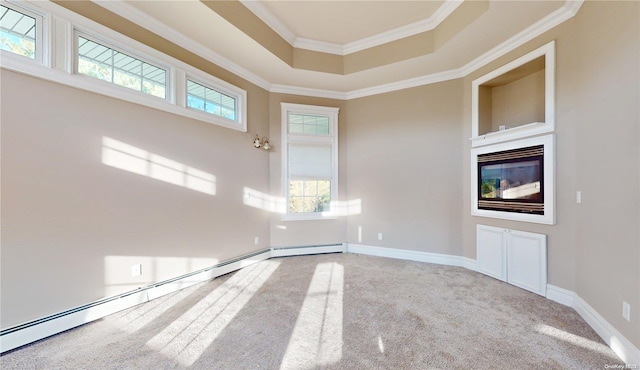 unfurnished room with crown molding, carpet floors, and a baseboard radiator