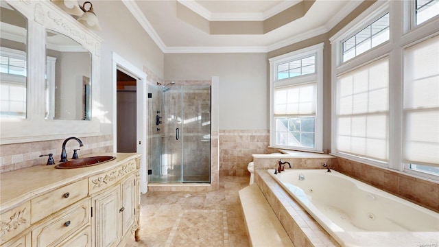 bathroom with vanity, ornamental molding, and independent shower and bath