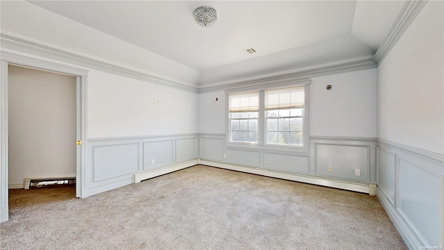 unfurnished room featuring lofted ceiling, light colored carpet, baseboard heating, and ornamental molding