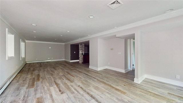 unfurnished living room featuring baseboard heating, light hardwood / wood-style floors, and ornamental molding