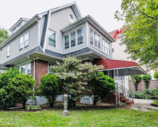 view of home's exterior with a yard