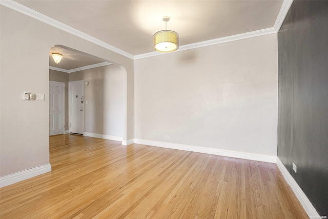 unfurnished room with ornamental molding and light hardwood / wood-style flooring