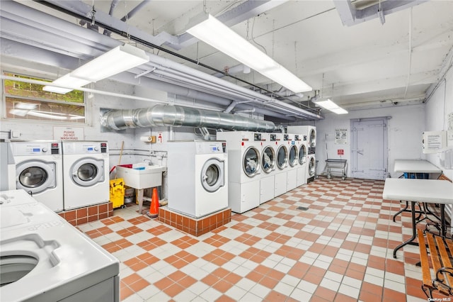 laundry area with washing machine and dryer