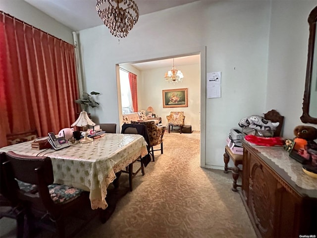 carpeted dining room with a notable chandelier