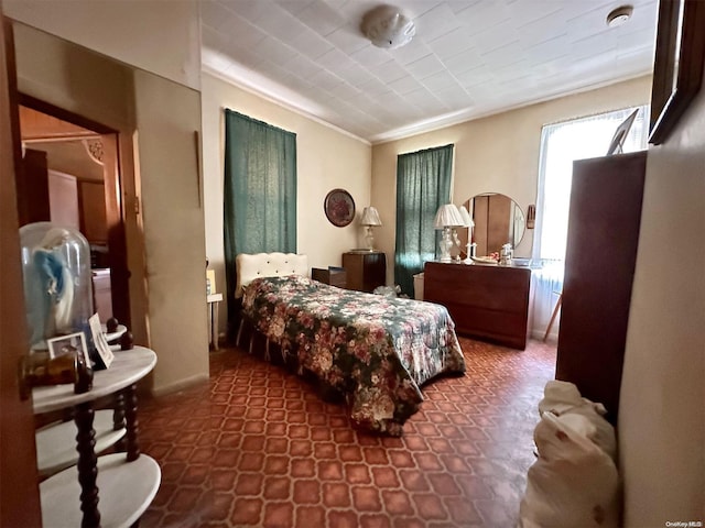 bedroom featuring crown molding