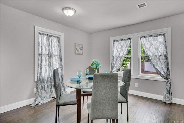 dining space featuring dark hardwood / wood-style floors