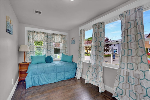 bedroom featuring dark wood-type flooring