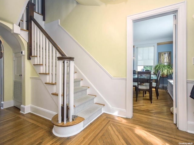 stairs with hardwood / wood-style flooring