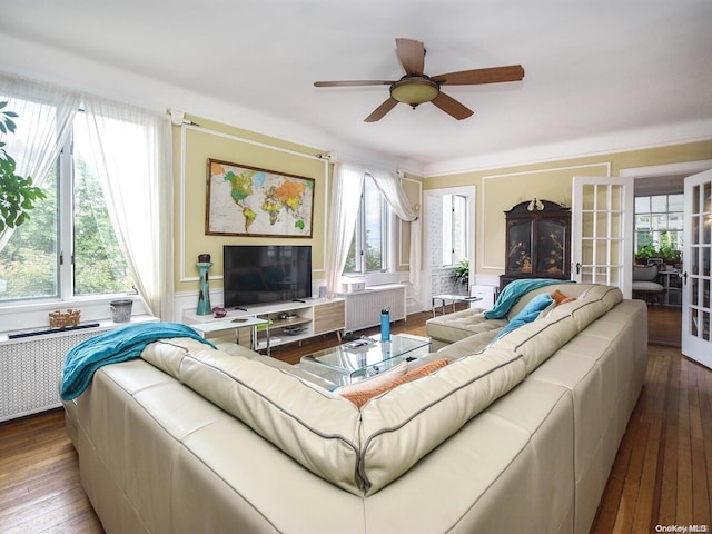 living room featuring wood-type flooring, french doors, plenty of natural light, and ceiling fan