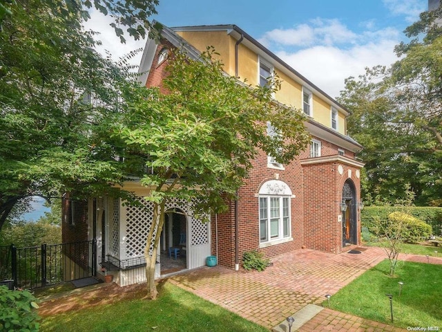 exterior space featuring a patio area and a yard