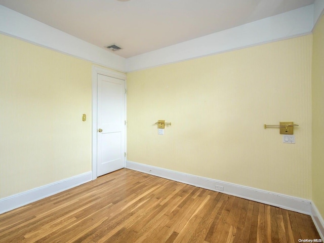 spare room featuring hardwood / wood-style floors