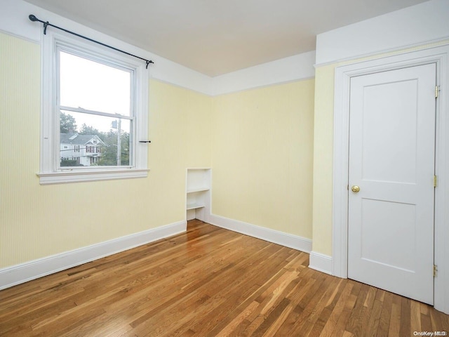 spare room featuring hardwood / wood-style flooring