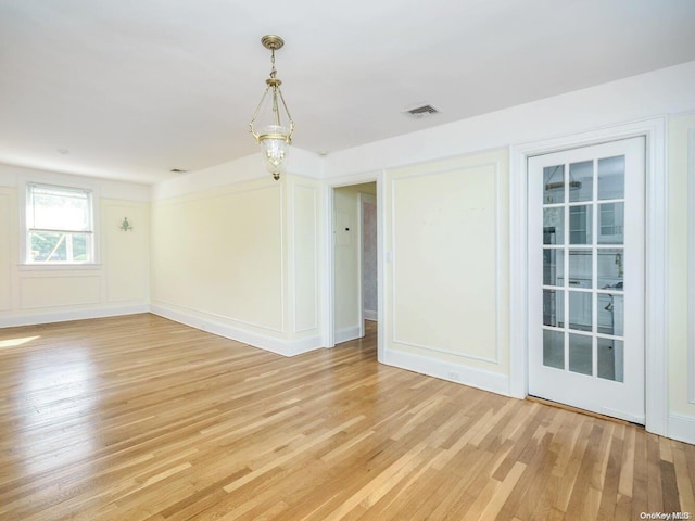 unfurnished room featuring hardwood / wood-style floors