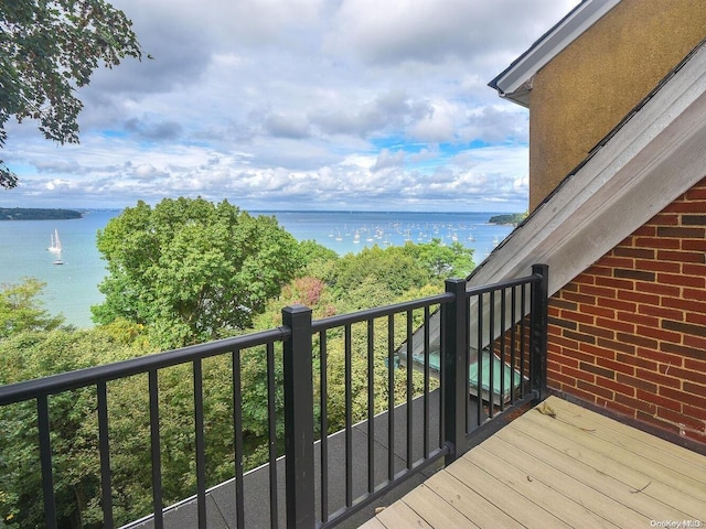 wooden terrace with a water view