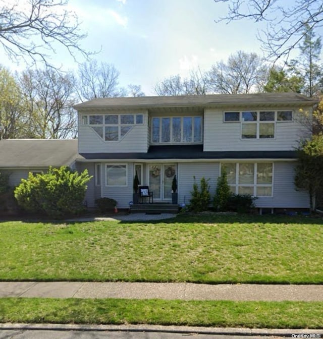 front facade with a front yard