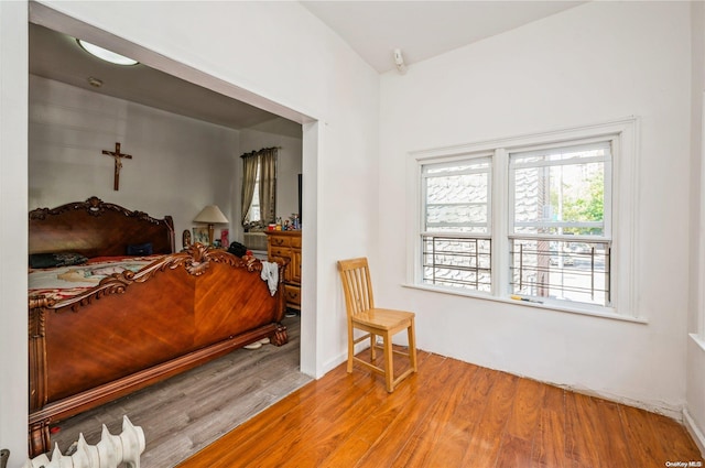 bedroom with wood-type flooring