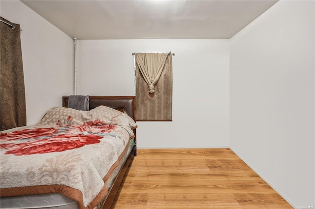 bedroom featuring hardwood / wood-style floors