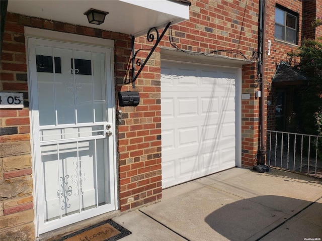 entrance to property featuring a garage