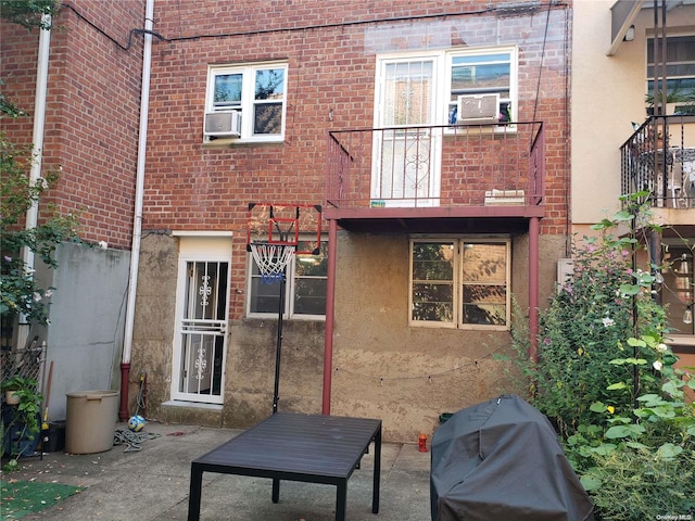 rear view of house with cooling unit