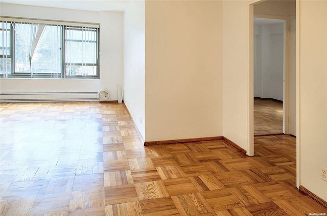 unfurnished room featuring light parquet flooring and a baseboard radiator