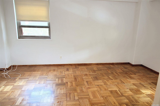 empty room with light parquet floors