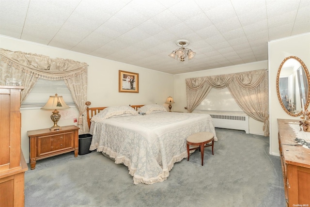 carpeted bedroom with radiator heating unit and ornamental molding