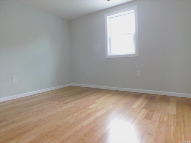 spare room with light wood-type flooring