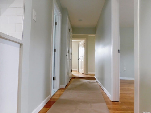 hall with light wood-type flooring