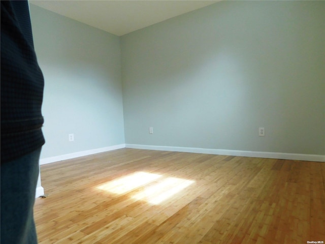 spare room featuring light hardwood / wood-style floors