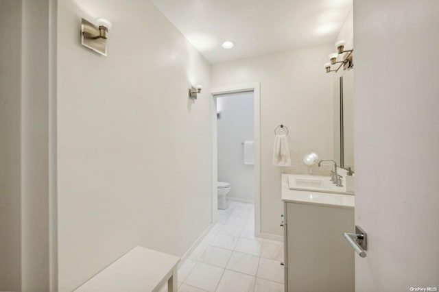 bathroom with tile patterned floors, vanity, and toilet