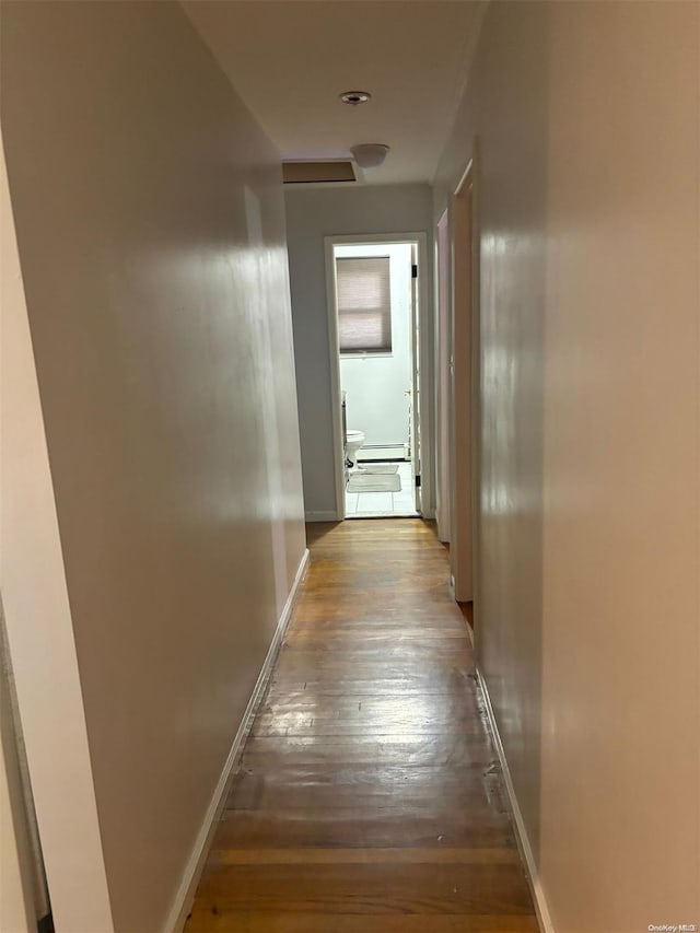 hallway featuring hardwood / wood-style floors