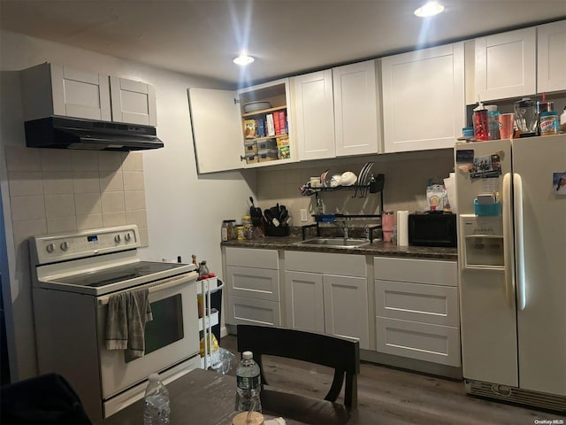 kitchen featuring white cabinets, dark hardwood / wood-style flooring, white appliances, and sink