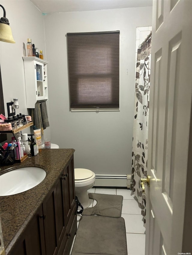 bathroom with tile patterned floors, toilet, vanity, and a baseboard heating unit