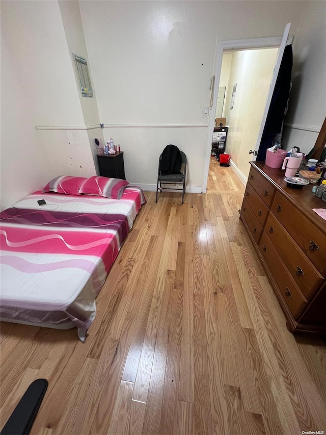 bedroom with light hardwood / wood-style floors