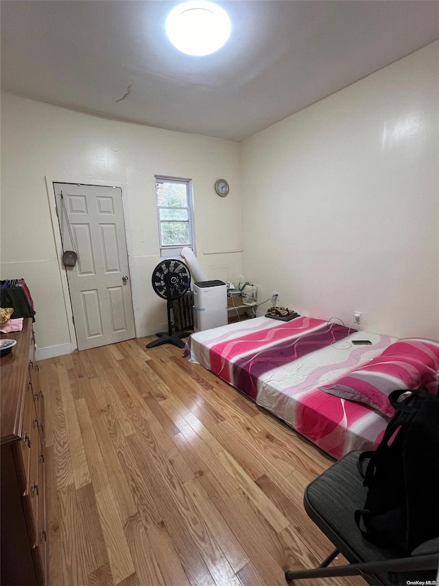 bedroom with light hardwood / wood-style floors