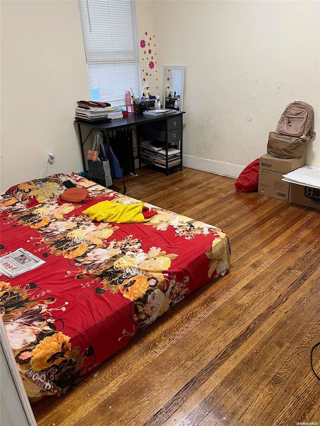 bedroom featuring dark wood-type flooring