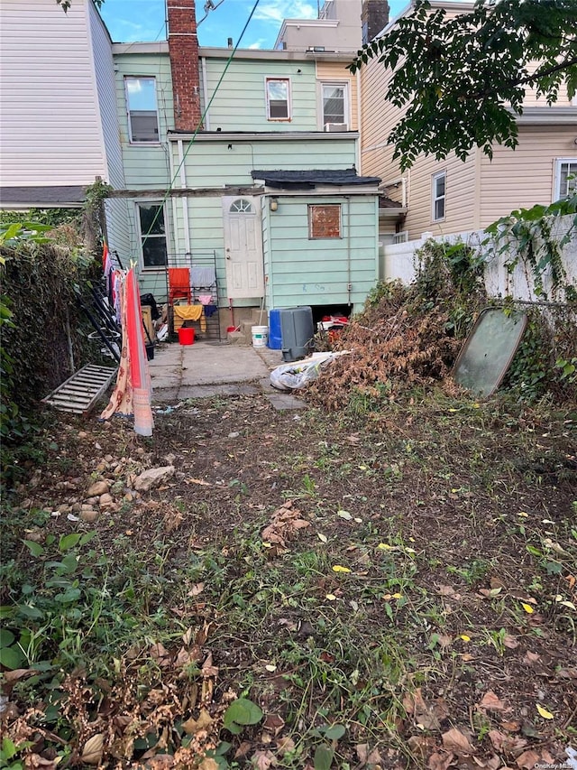 back of property with a patio area